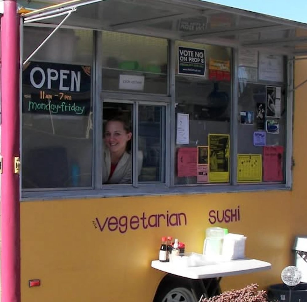 Kalindi smiling from the window of the Agogo Sushi truck